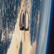 Pulling away from Earth.